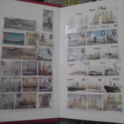 STAMP ALBUM WITH STAMPS OF SHIPS AND RAILWAY ENGINE THEME AS IN IMAGE RE224